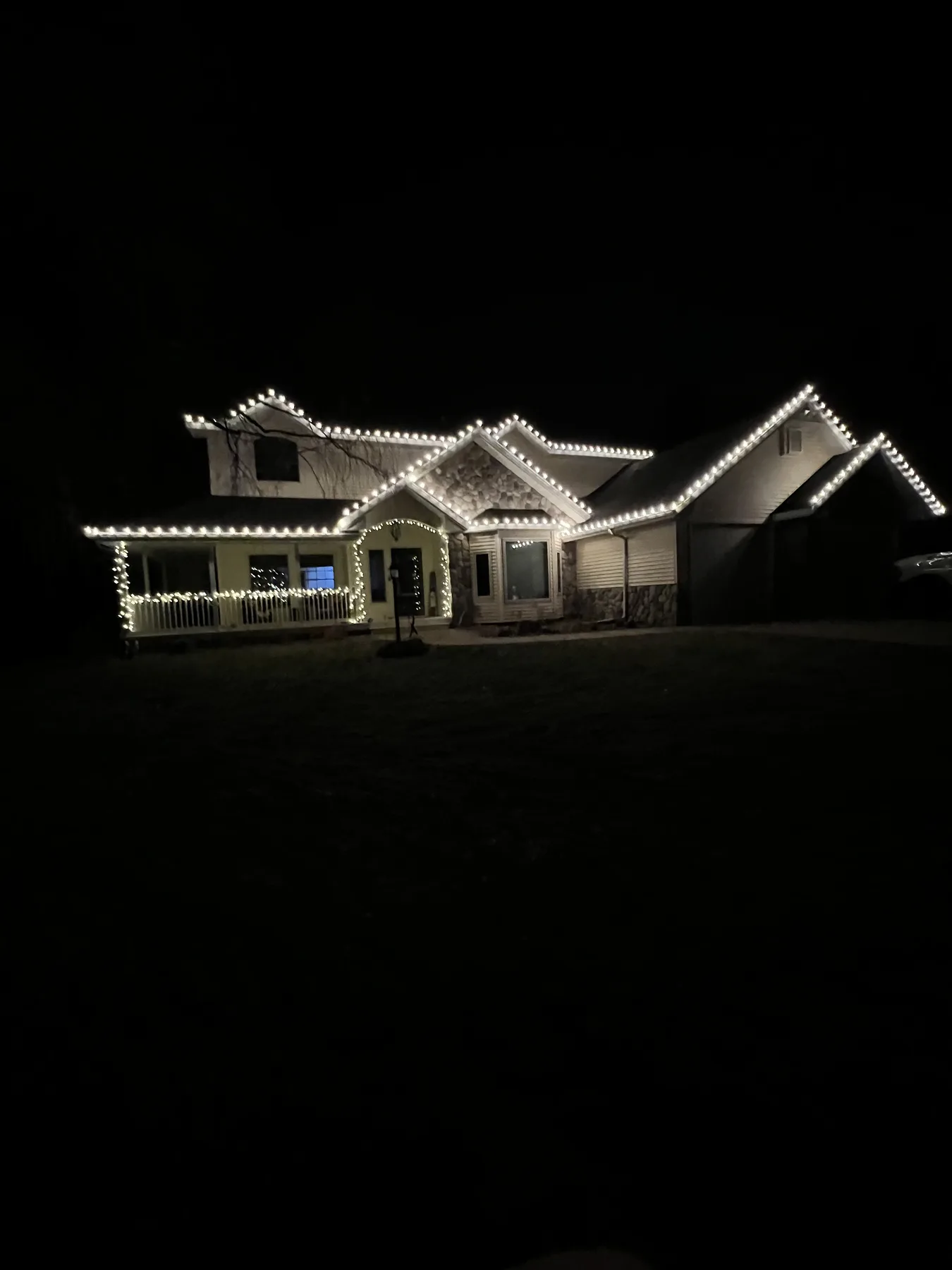 Residential holiday lighting display installed for the winter season