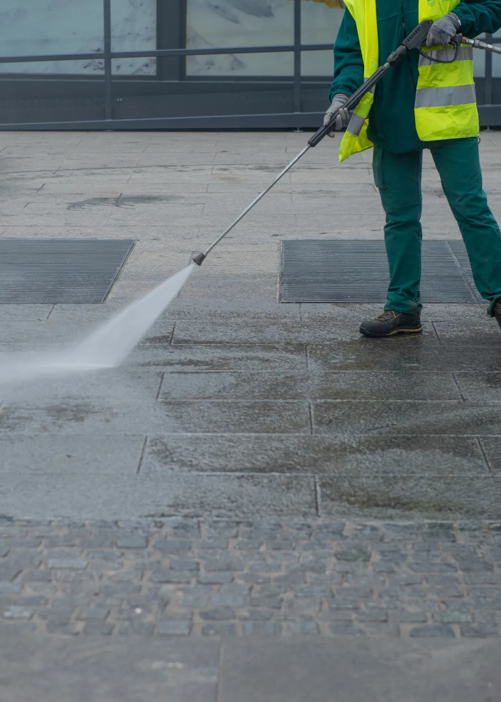 Surface pressure washing removing grime from concrete